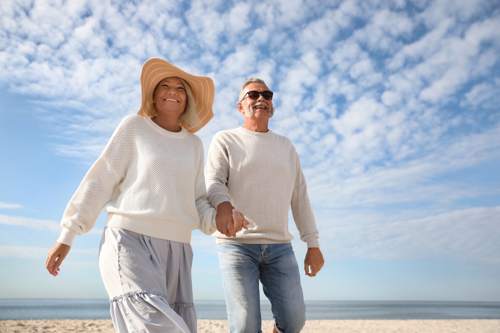 Mature couple spending time together on sea beach