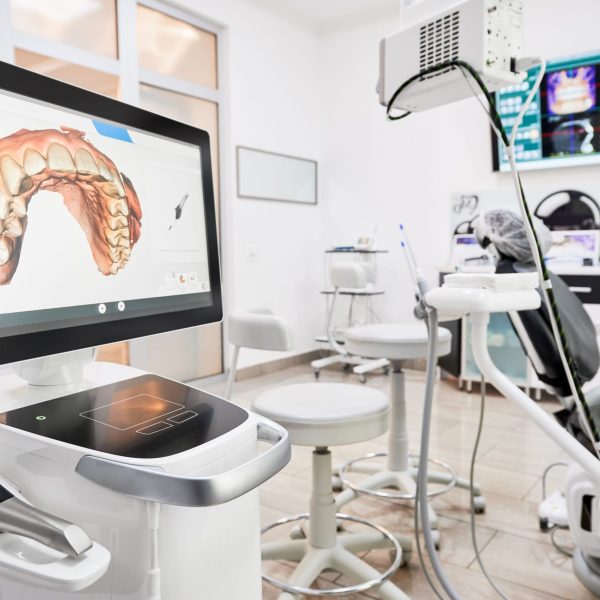 Interior of dental office with modern equipment and dental intraoral scanner