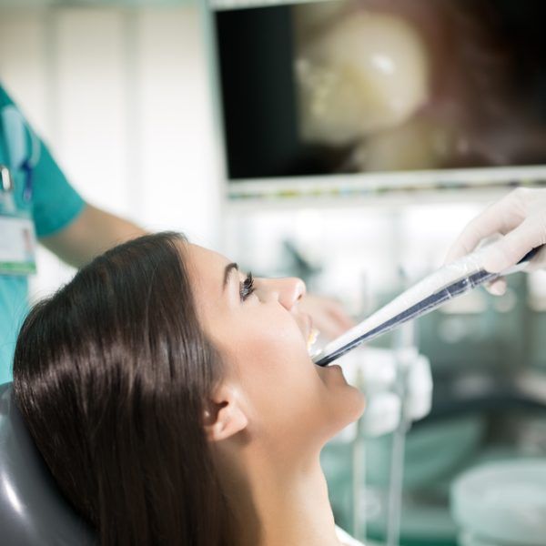 Dental office-specialist tools, intro oral dental camera with live picture of teeth on the monitor
