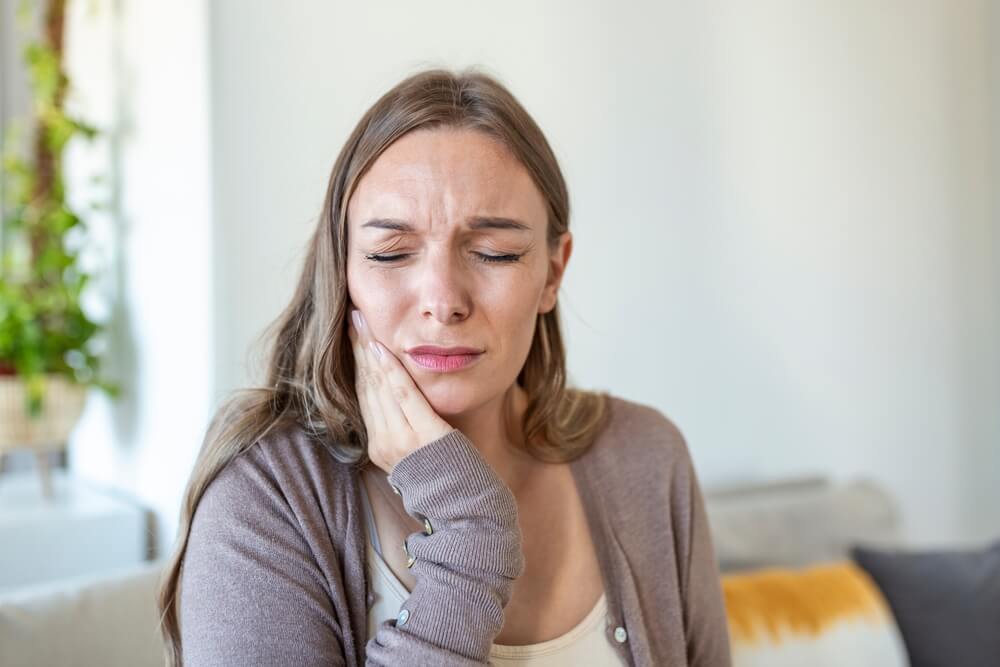 Young Woman Suffering From Terrible Strong Teeth Pain