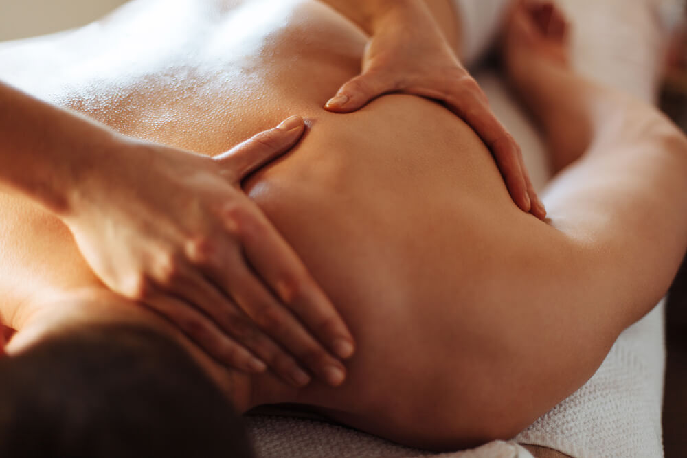 Close-up of a client's back being massaged