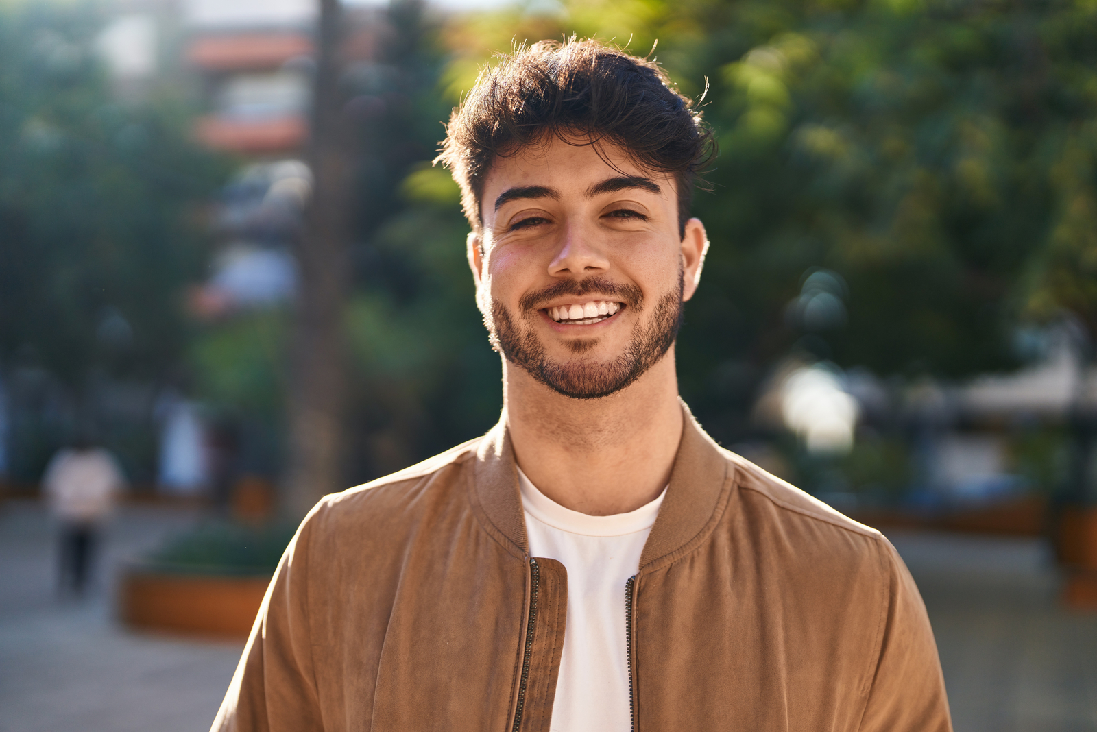 Young hispanic man smiling confident standing at park