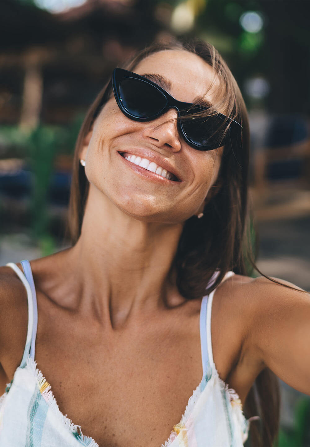 Young freelancer smiling while taking selfie