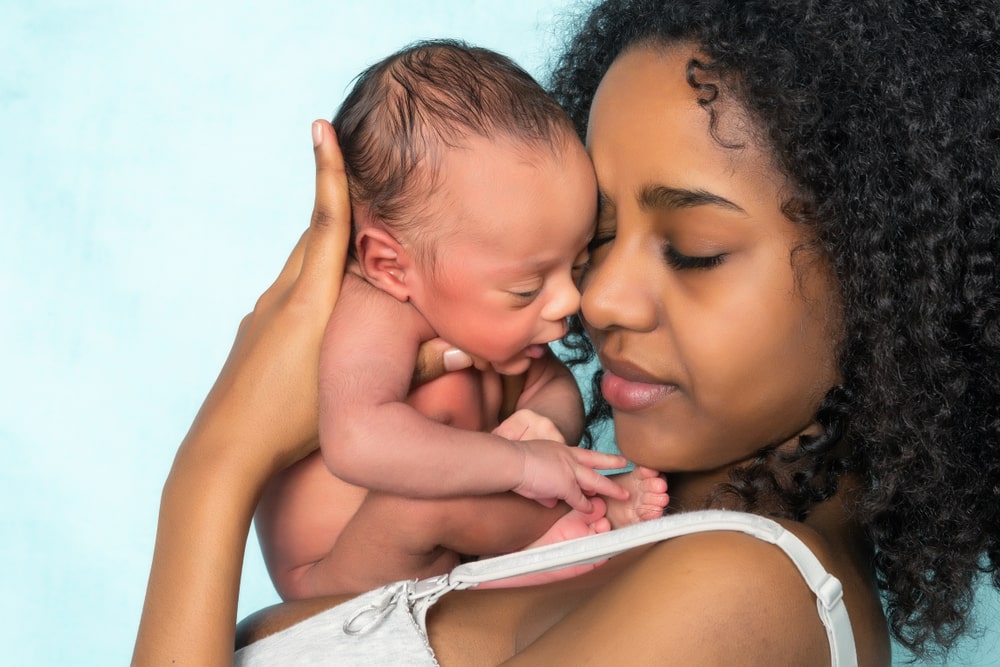 Loving mother holding newborn baby