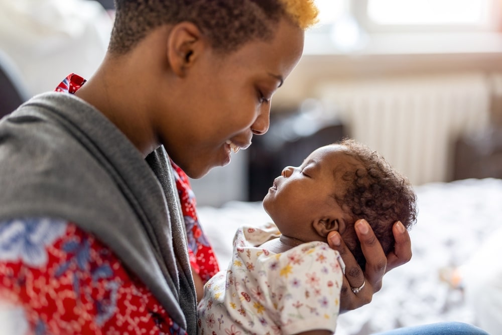 mother spending time with her newborn baby