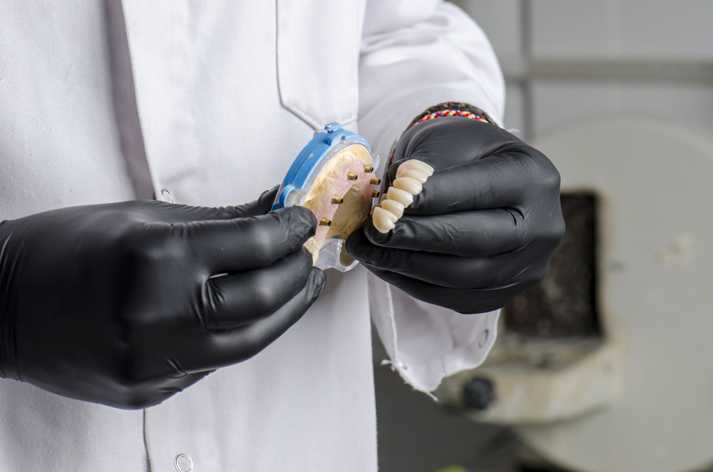 Dental Technician Holding A Monolithic Zirconia