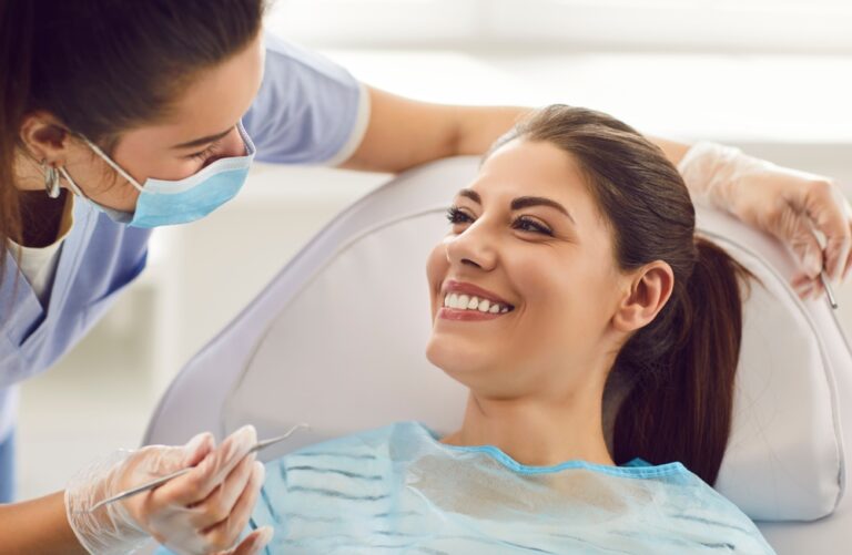 Happy smiling woman at dentist exam, teeth, gums, dental care exam