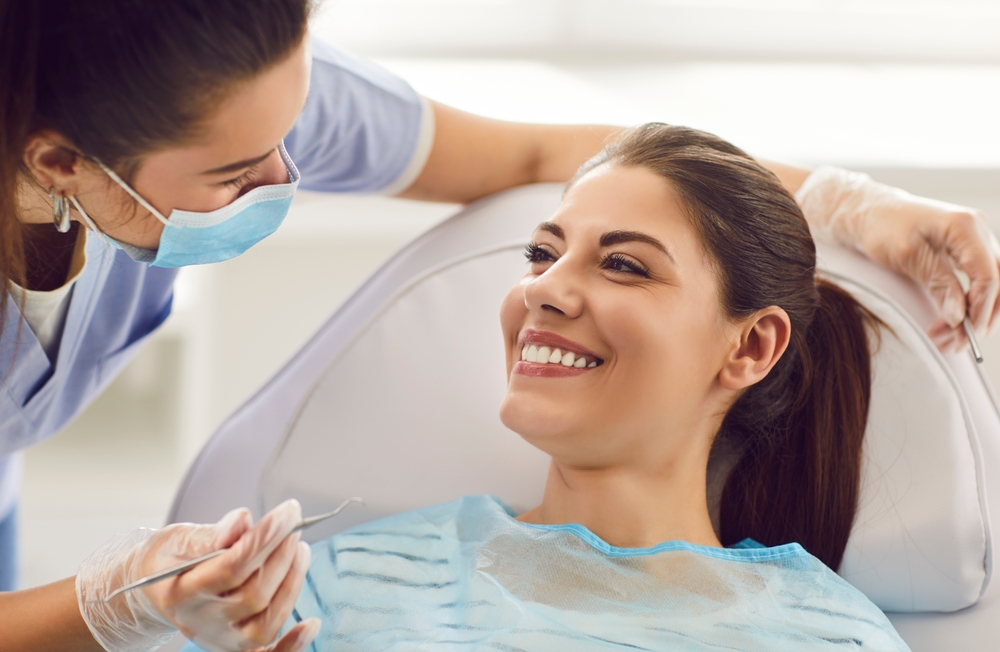 Happy smiling woman at dentist exam, teeth, gums, dental care exam