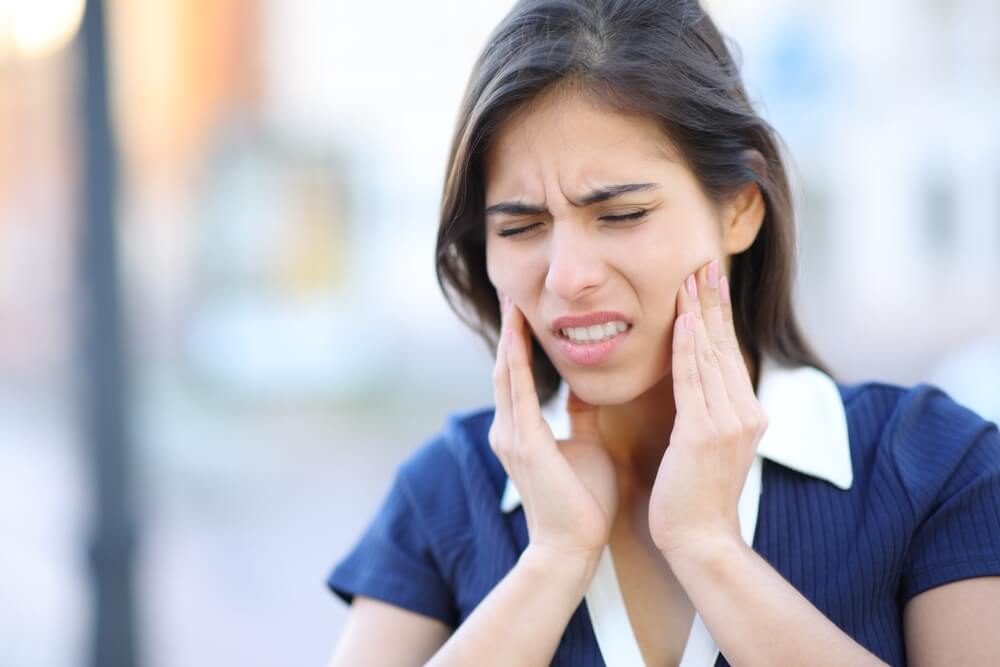 Stressed woman suffering tmj