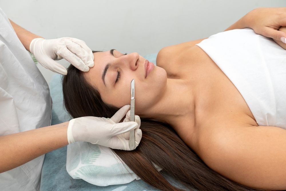 A woman receiving Dermaplaning treatment