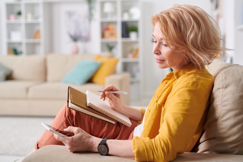 Blonde mature woman writing