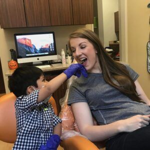 A little boy at a reception with a dentist