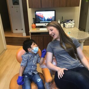 A little boy at a reception with a dentist