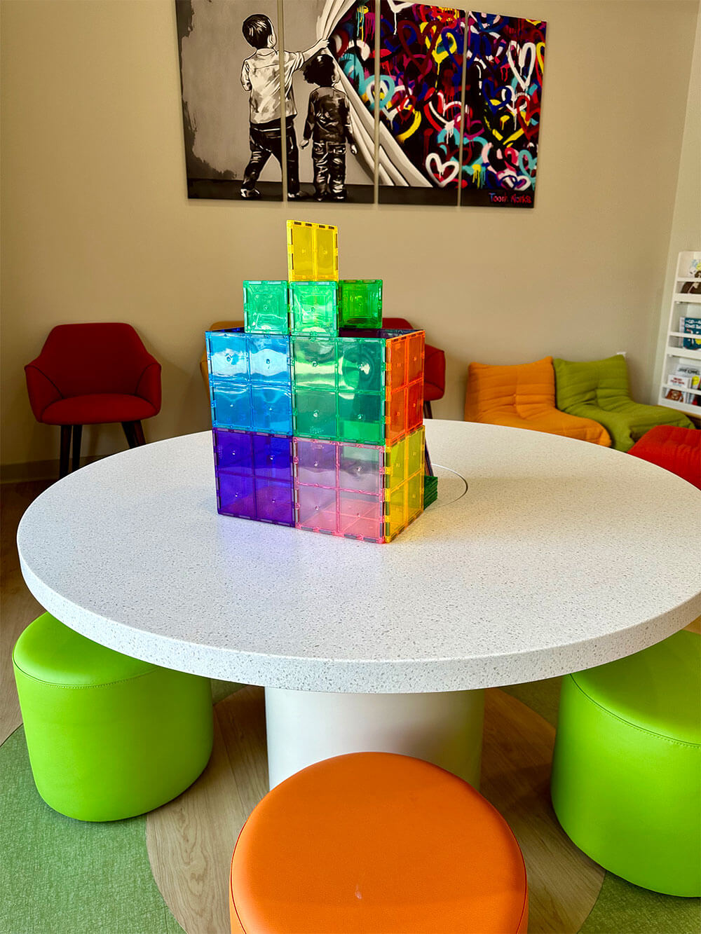 Colorful desks, chairs, lockers and white board in the Kindergarten classroom.