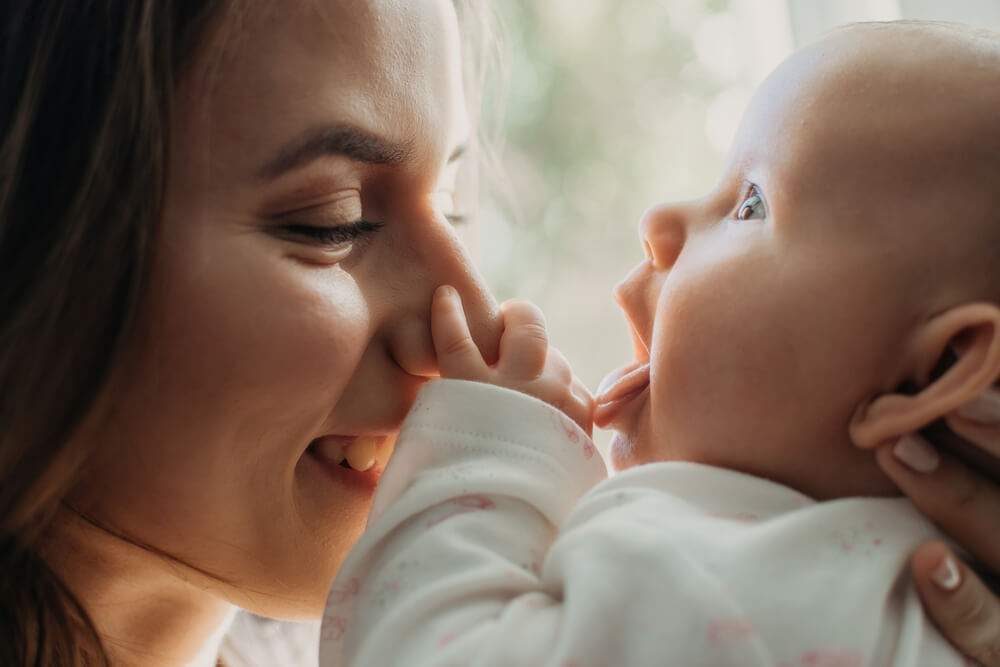 Postpartum Disorders, postpartum baby blues, depression. Portrait of happy mother and newborn baby