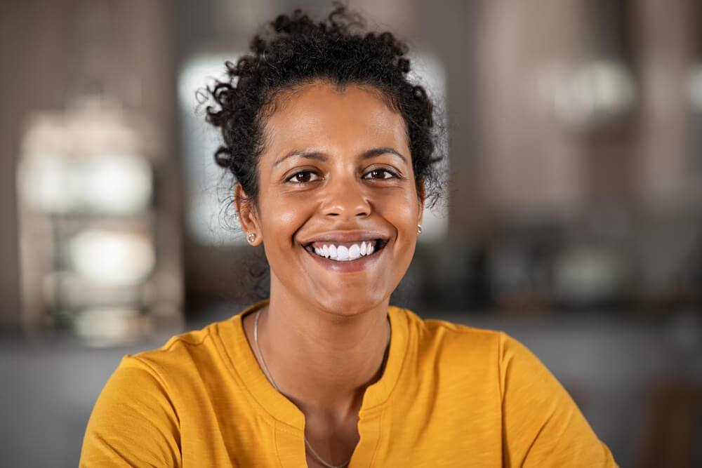 beautiful mid adult woman smiling at home