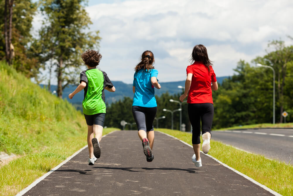 mother and kids running outdoor