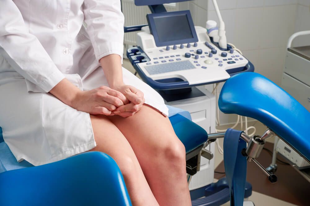 Woman at gynecologist office sitting and waiting for a doctor with test results