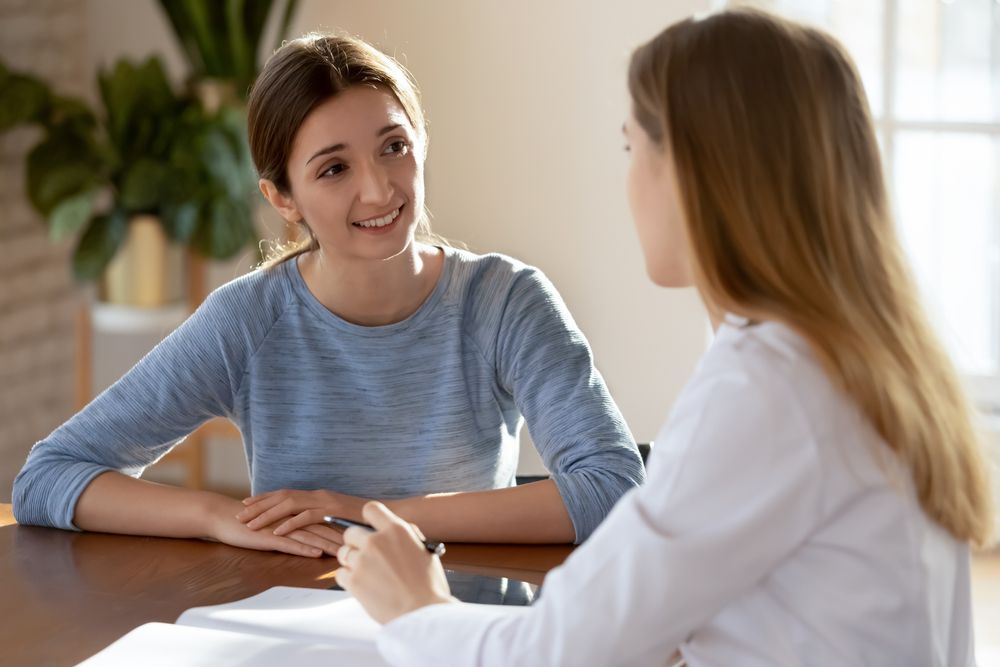 Woman speaking with a medical professional about Urogynecology 