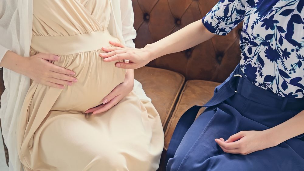 A pregnant woman with the assistance of midwifery services