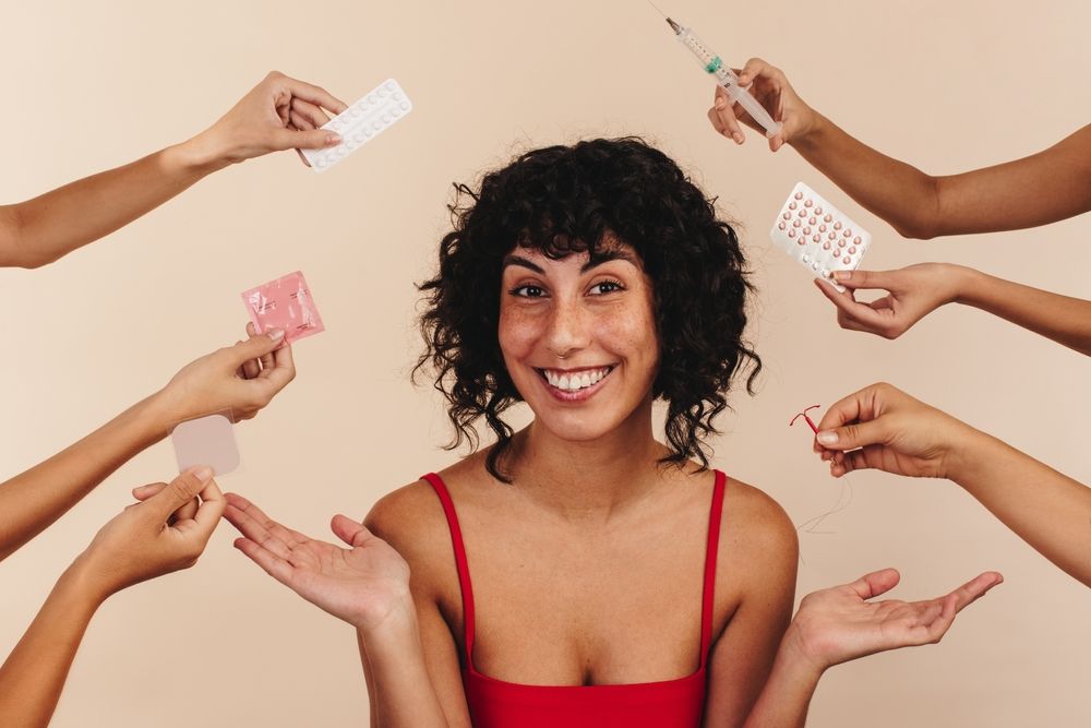 Woman surround by different birth control options