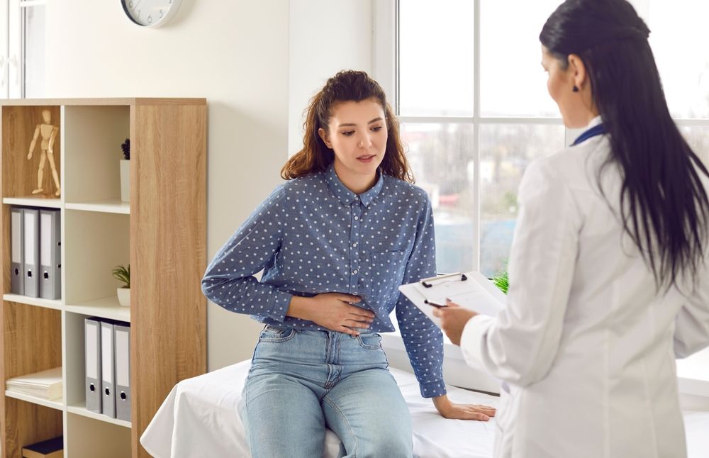 Woman speaking with medical professional about assistance with pelvic prolapse