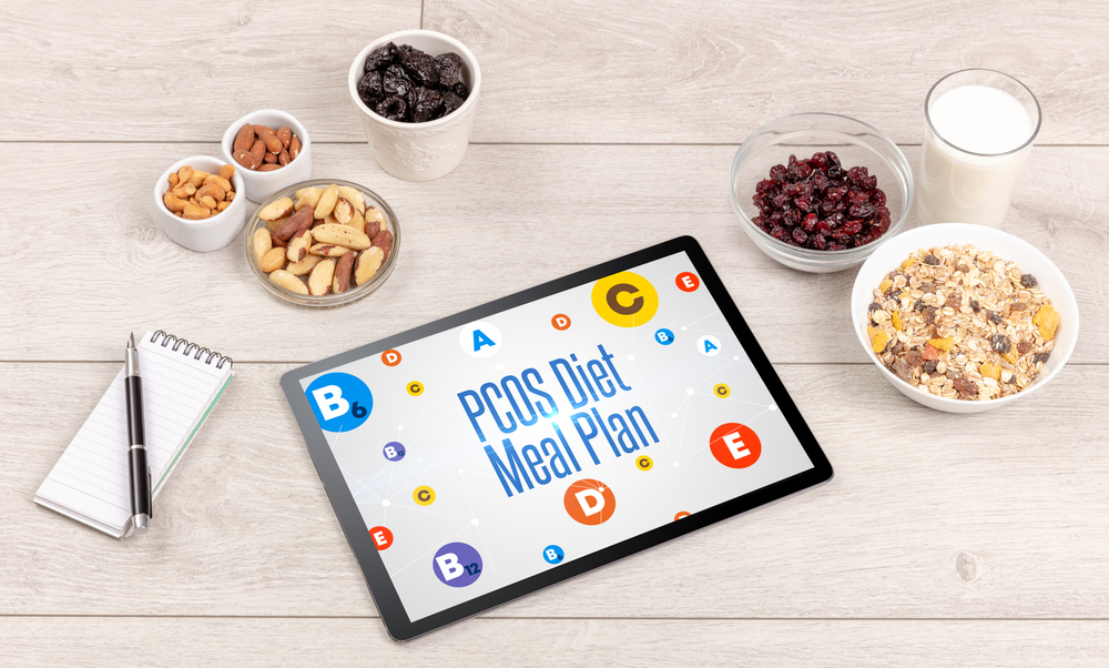 Healthy Tablet Pc compostion with PCOS Diet Meal Plan inscription, weight loss concept