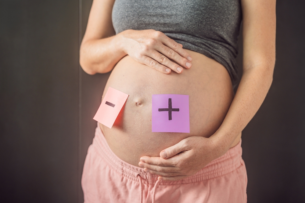 A pregnant mother faces Rhesus conflict with her child, highlighting the complex challenges of maternal and fetal blood type incompatibility