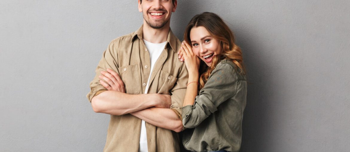 cheerful young couple standing together