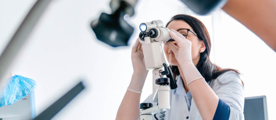 Low angle view of gynecologist examines patient