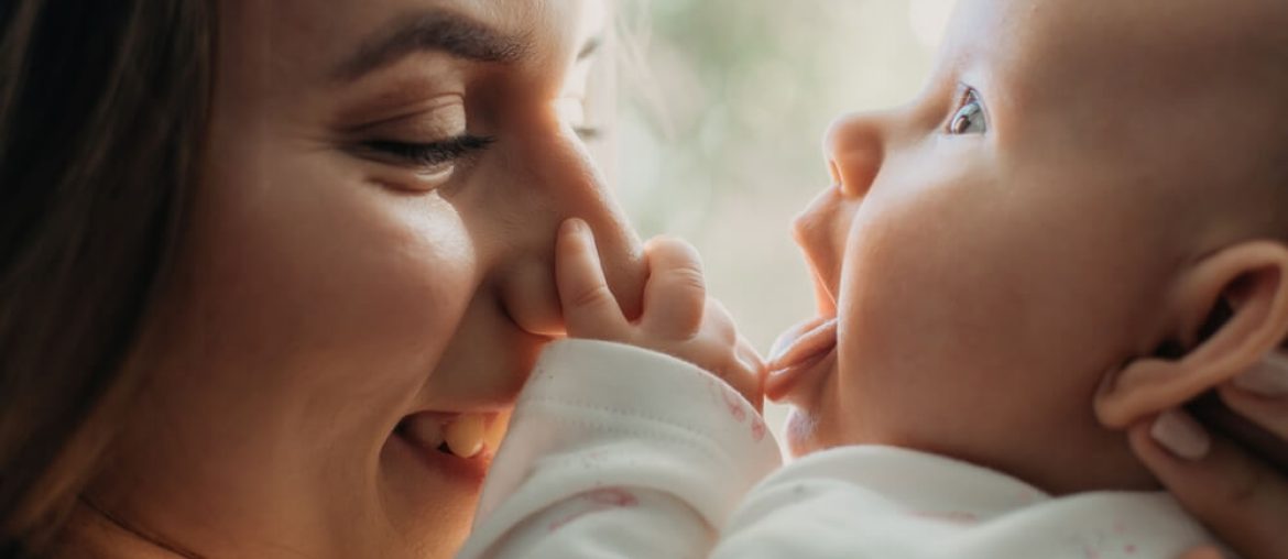 Postpartum Disorders, postpartum baby blues, depression. Portrait of happy mother and newborn baby