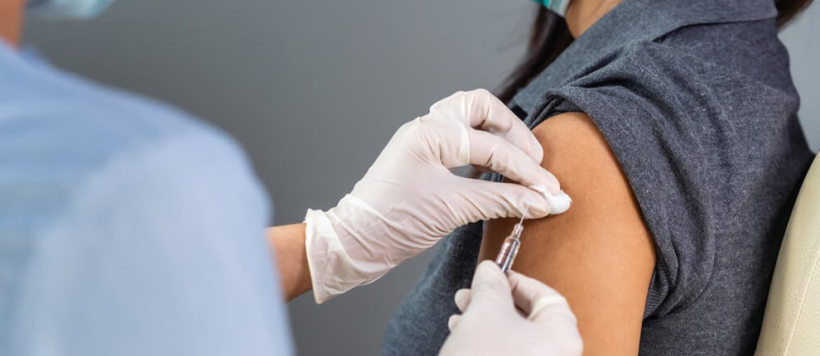 Doctor holding syringe and using cotton before make injection