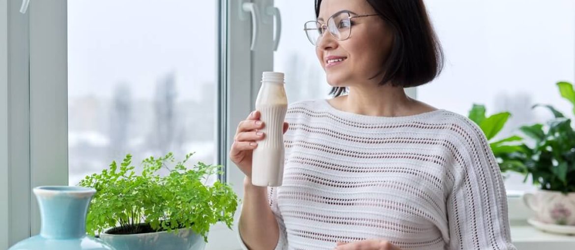 Middle-aged woman drinking milk