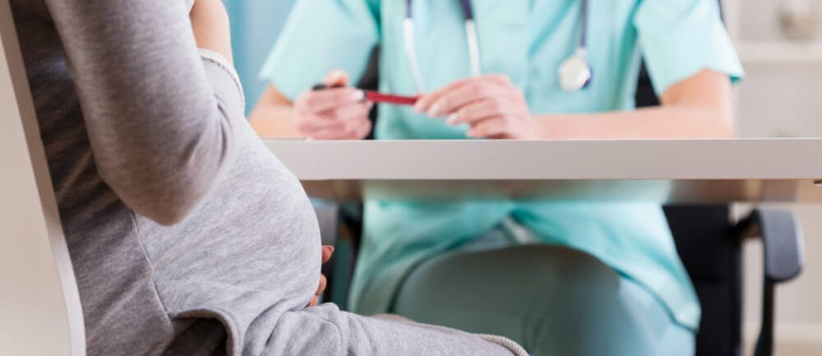 pregnant woman during medical visit