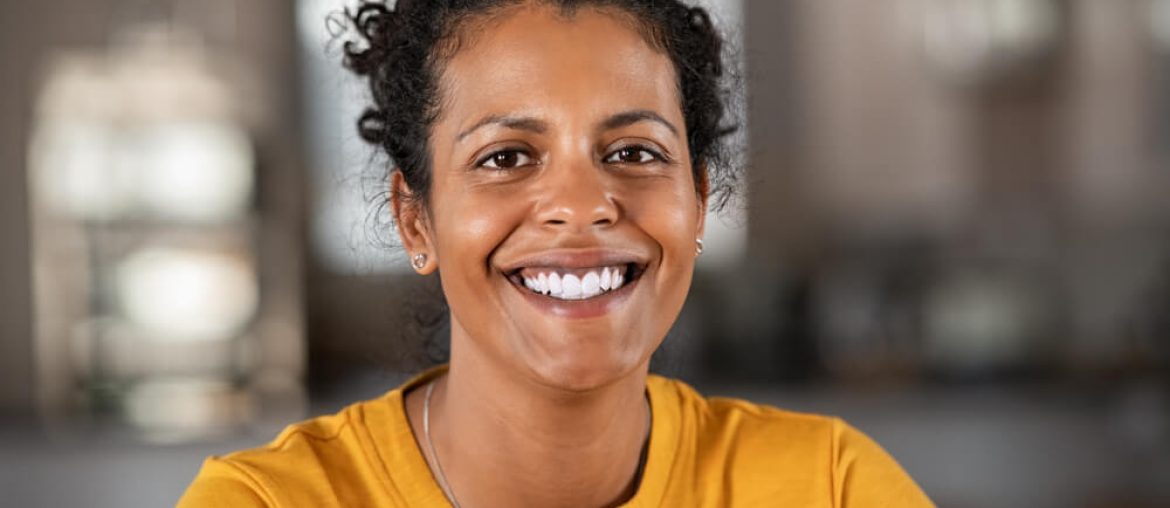 beautiful mid adult woman smiling at home