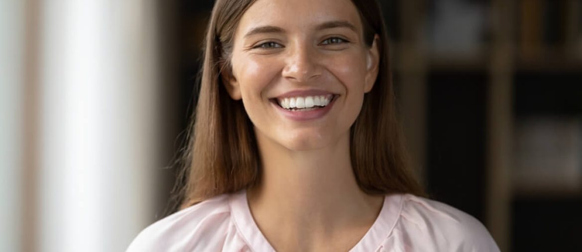 Happy beautiful young woman with perfect white teeth