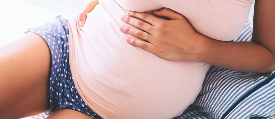Pregnant woman suffering lower back pain