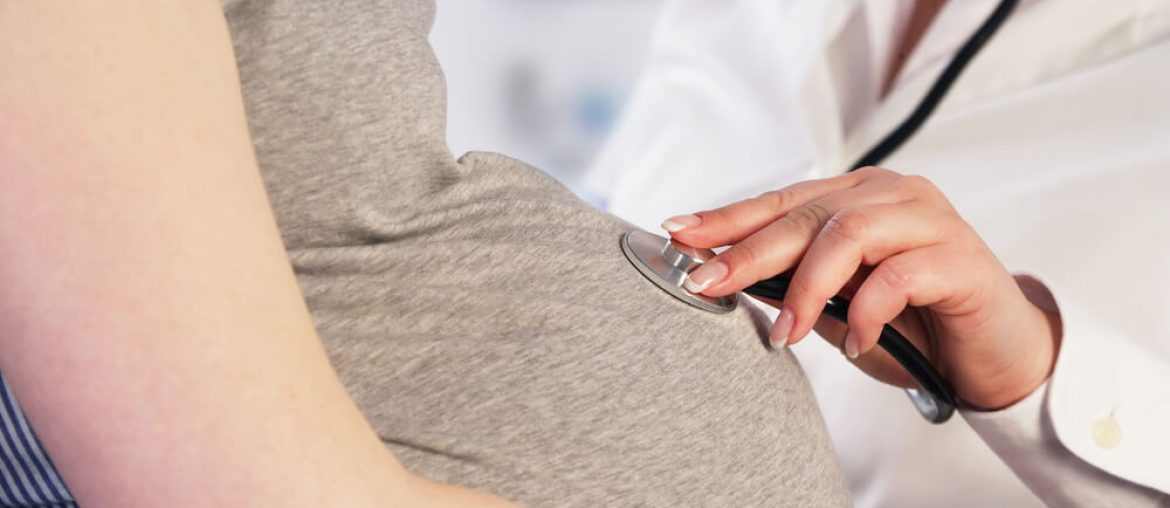 Doctor examining a pregnant woman