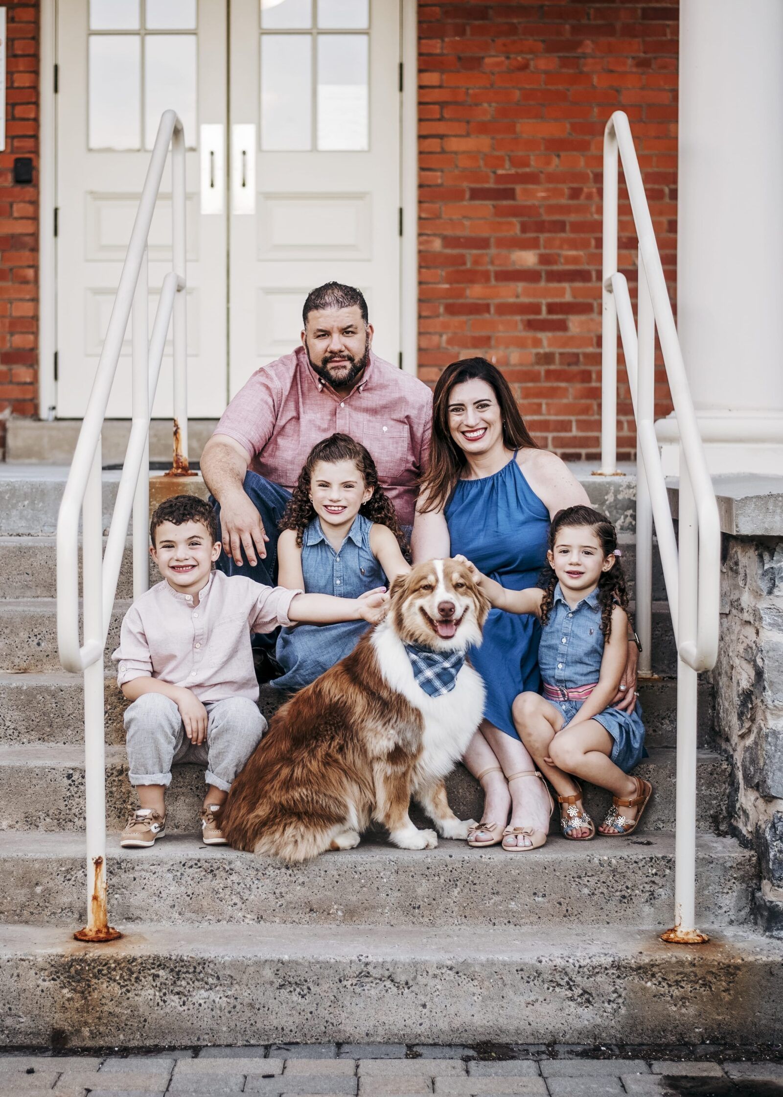Dr. Maria Laura Ybarra with family and pet dog