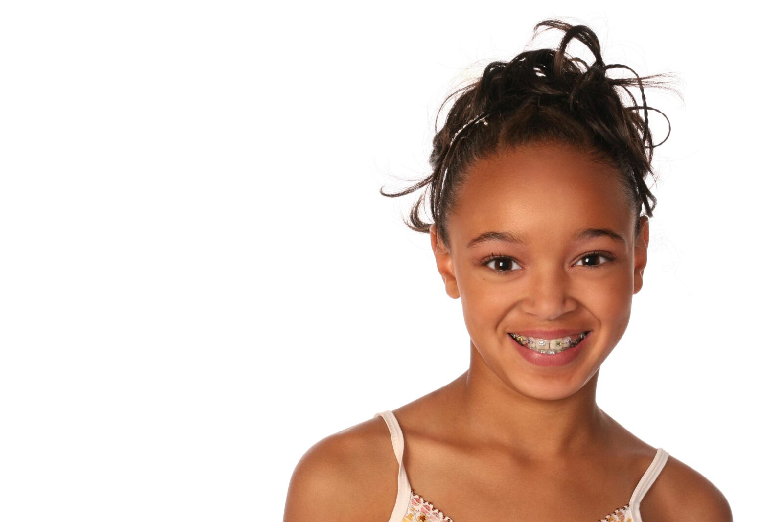 Young teen girl smiling with braces