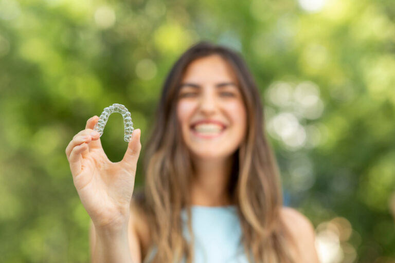 Woman Is Holding An Invisalign