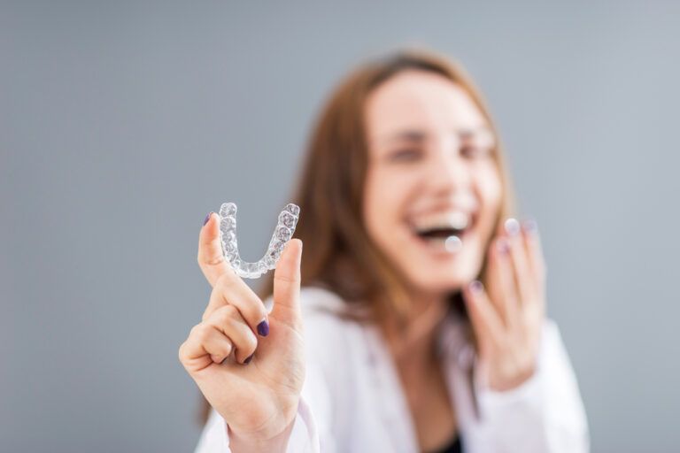 Woman Is Holding An Invisalign