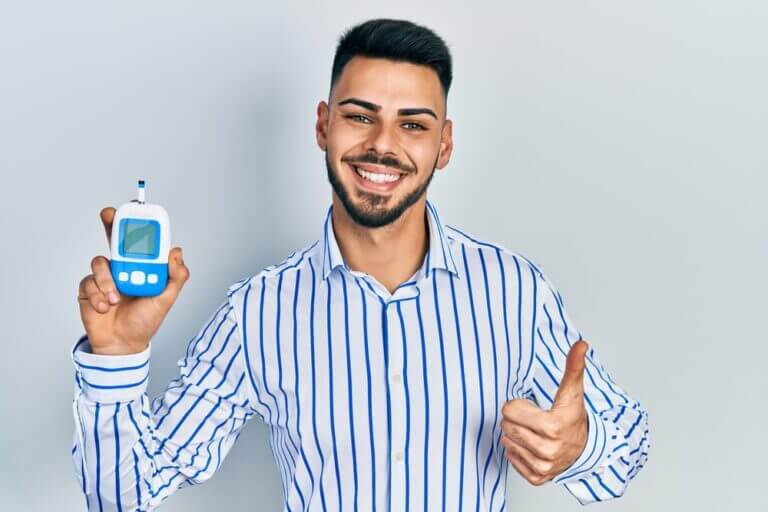 Young man smiling with thumb up