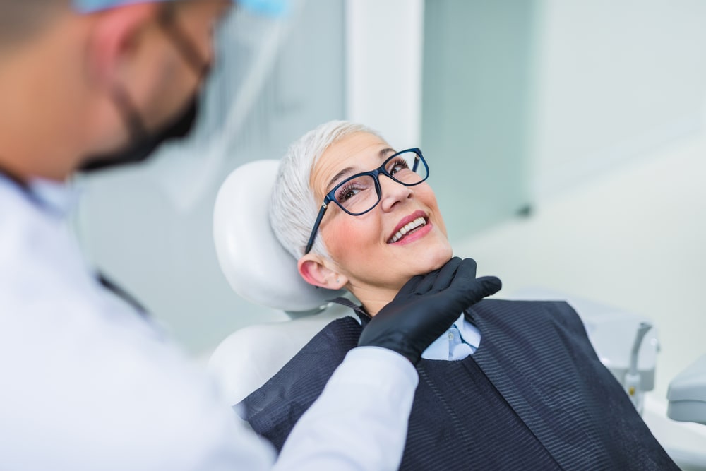 Beautiful senior woman having dental treatment