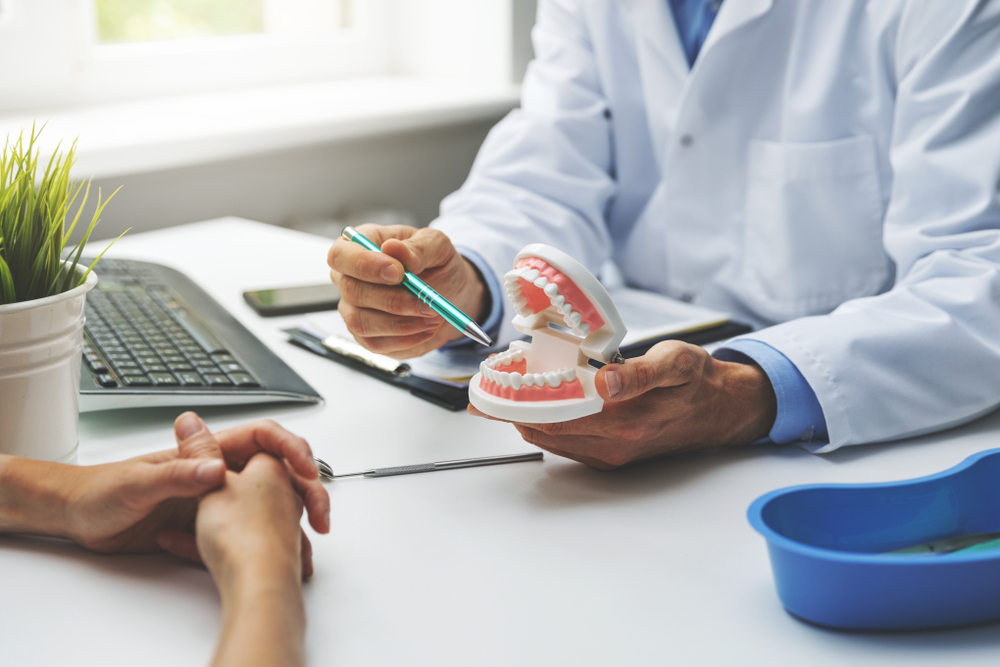 A doctor explaining Dentures to a patient