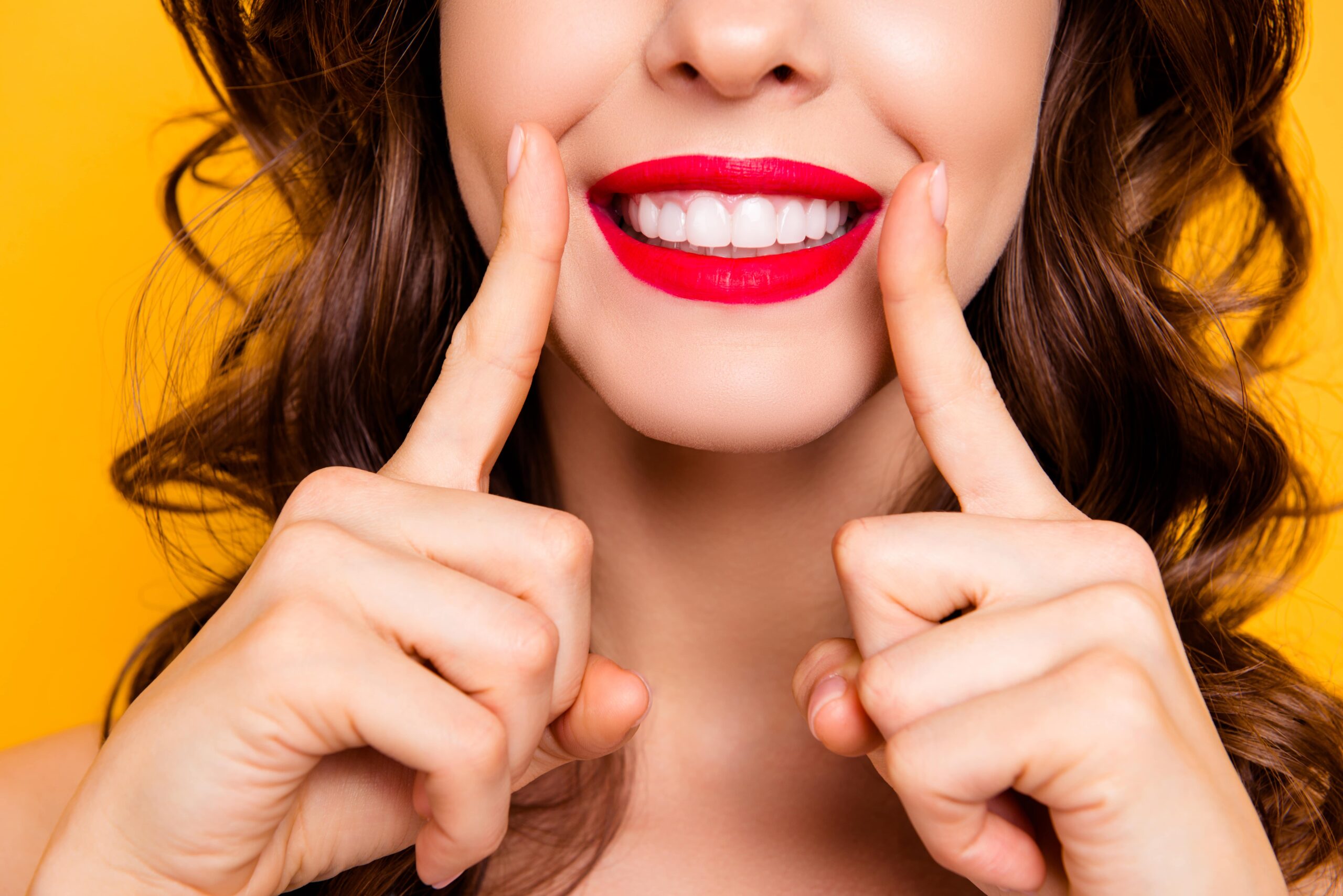 pretty woman smiling with lipstick