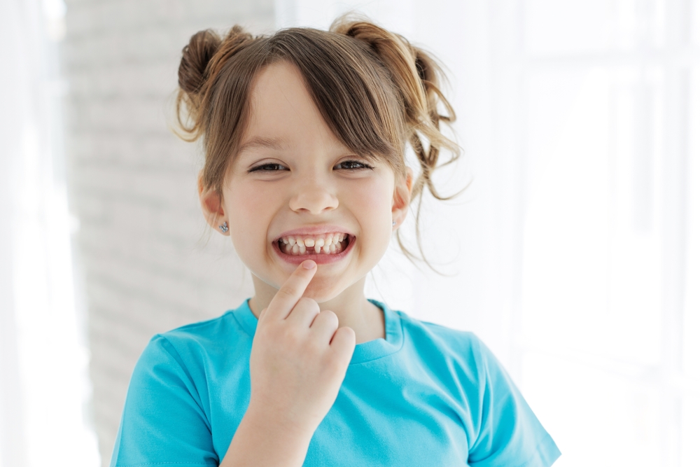 The kid lost a tooth. Baby without a tooth