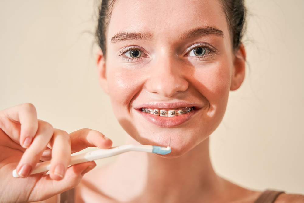 Portrait,View,Of,The,Brunette,Women,Brushing,Her,Teeth,That