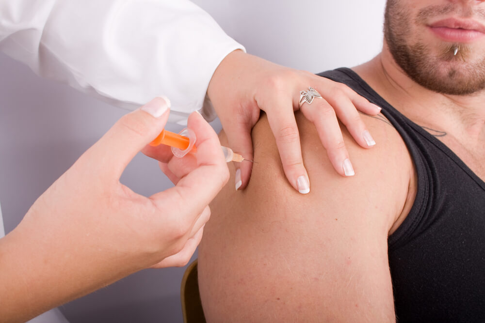 Young doctor women give an injection