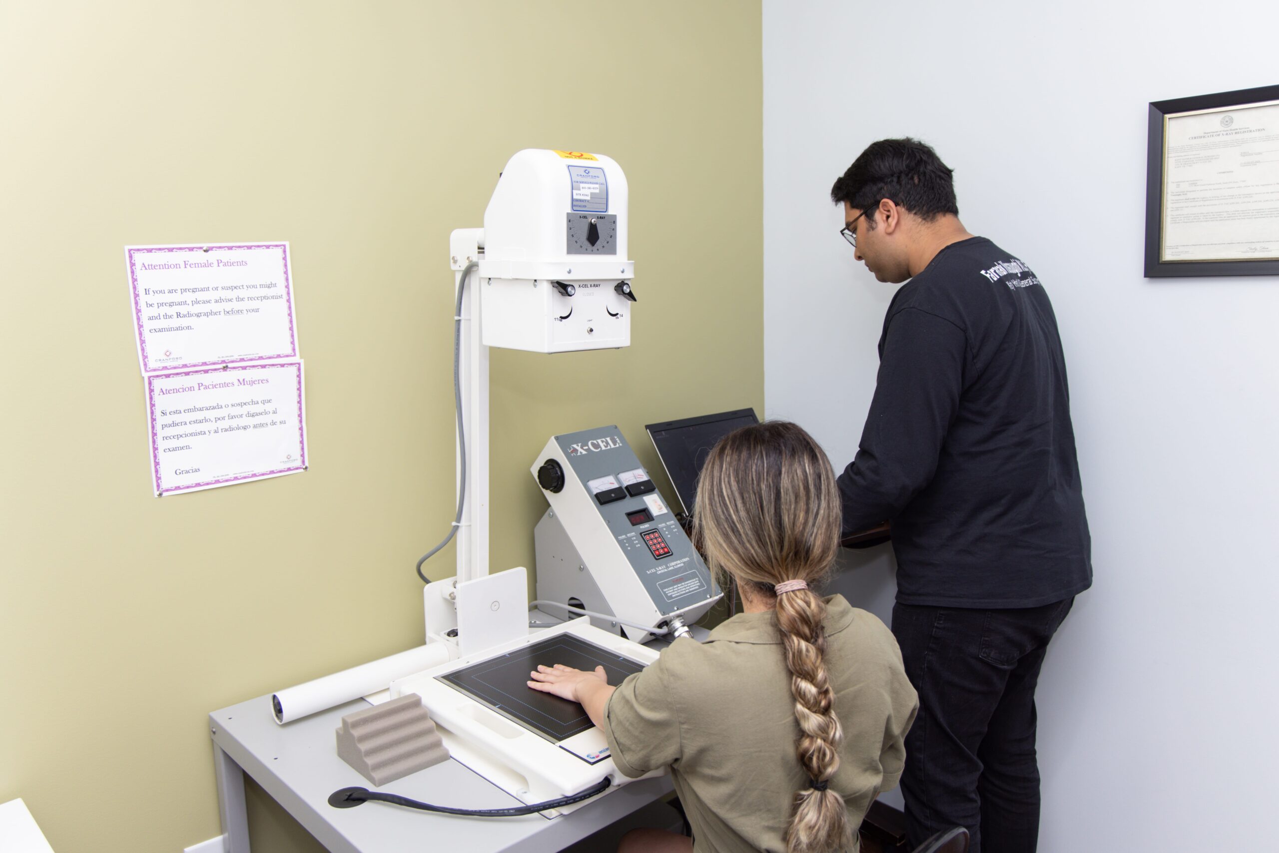 Staff member doing XRAY of patient's hand